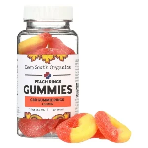 A jar of gummies with a bottle next to it.